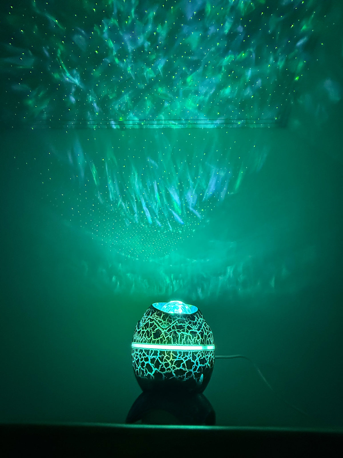 A sensory nightlight with a colourful starry projection and soothing sounds