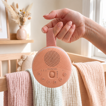mama holding peach sound machine