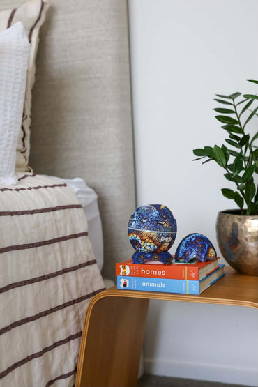 blue nightlight perched on books in a childs room